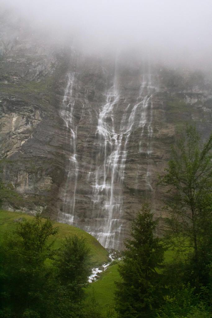 Waterfall in heavy rain in the Lauterbrunnen Valley in Switzerland