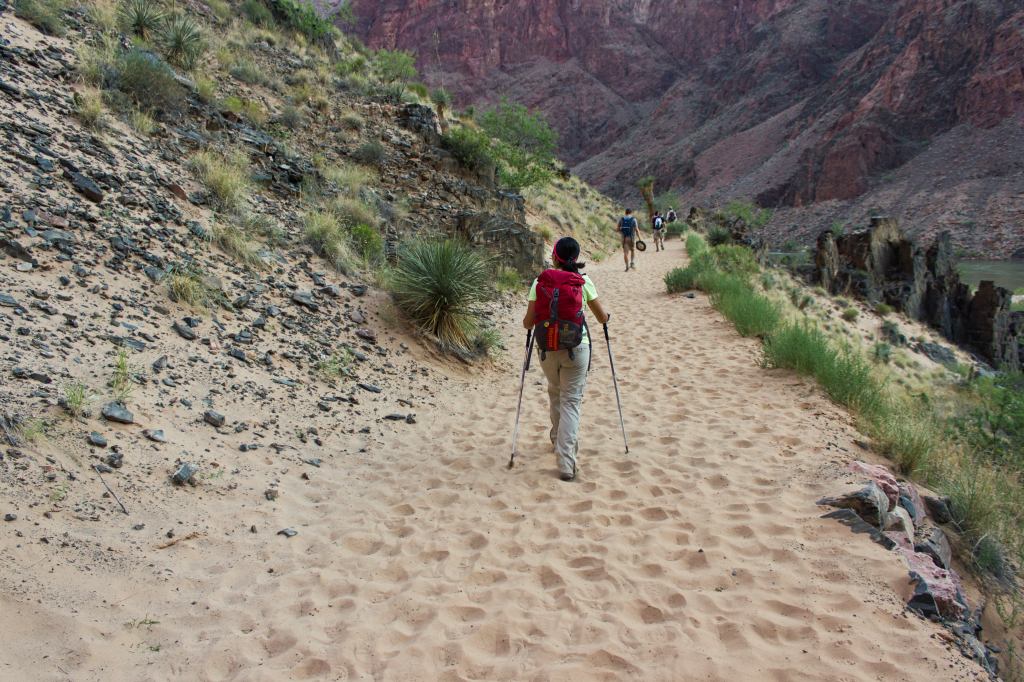 Hiking along a sand covered trail in the Grand Canyon